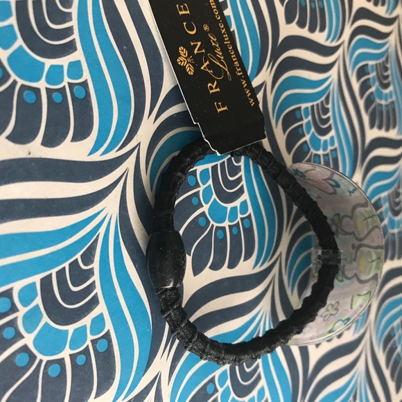 Fancy NEW floral pony holder France Lux